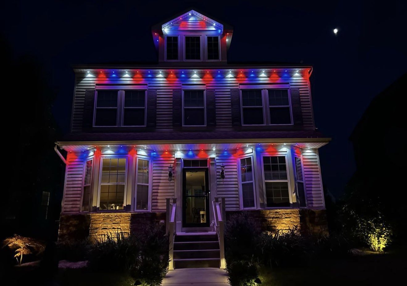 Clean roofline permanent lighting at dusk